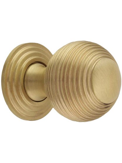 Solid-Brass Reeded Round Knob with Rosette - 1 1/4 inch Diameter in Satin Brass.